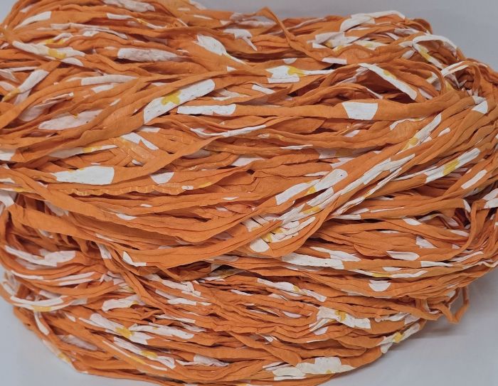 Oranssinkirjavaa trikookudetta